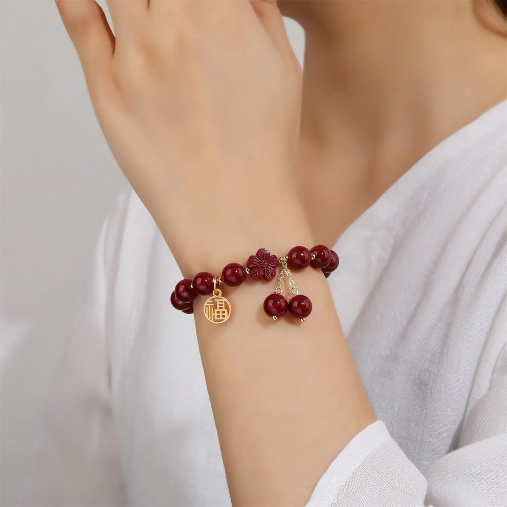 Retro national style cinnabar bracelet with purple gold sand, fu character and peach blossom motifs