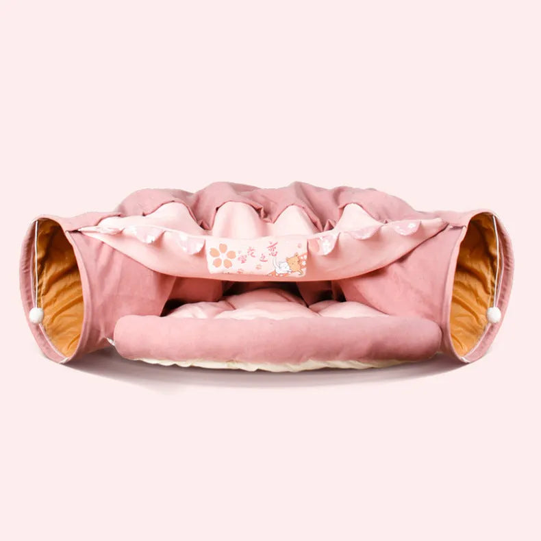 Collapsible cloth cat tunnel shown in a pop-up cylinder shape and folded flat, in a choice of colours.