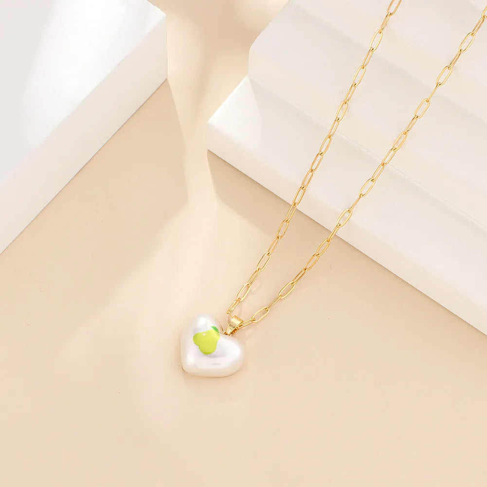 Silver tone heart necklace with geometric fruit pendant on adjustable 21-50cm chain