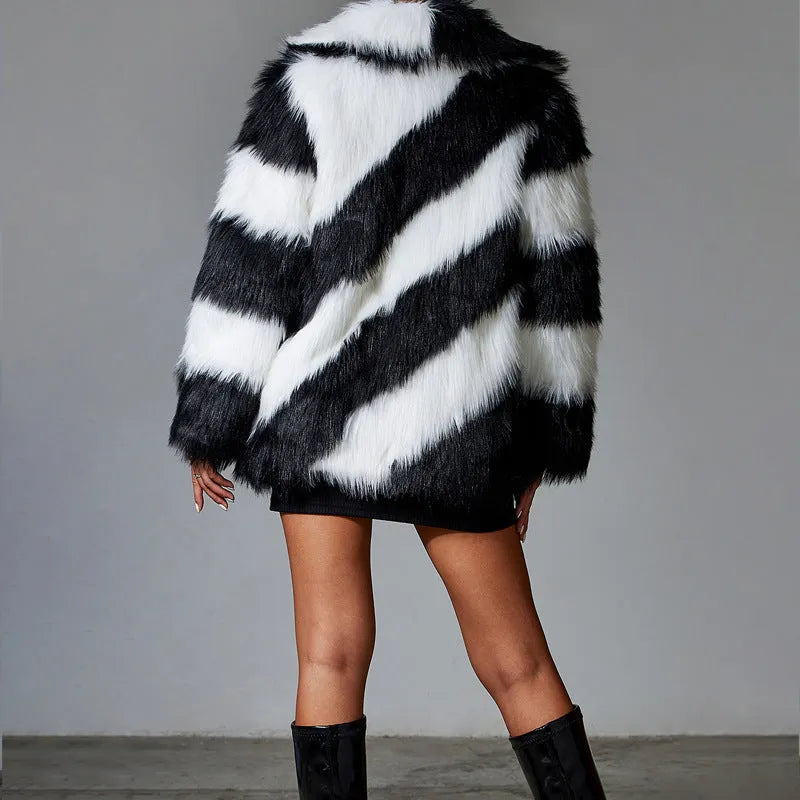 Faux fur coat with contrasting colour lapel and a attached fur collar.