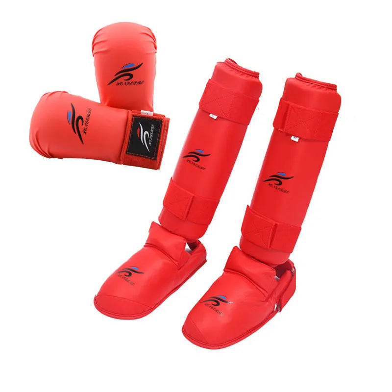 Karate protective gear set with red boxing gloves, leg guards and helmet for martial arts training