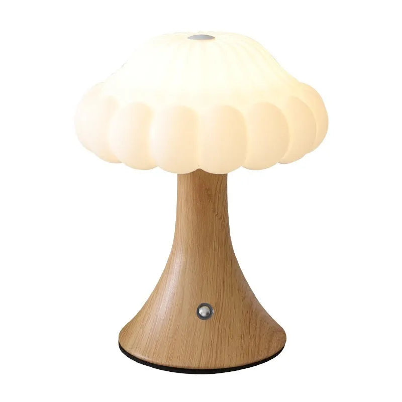 Mushroom-shaped touch control night lamp in wood grain colour on a wooden table.