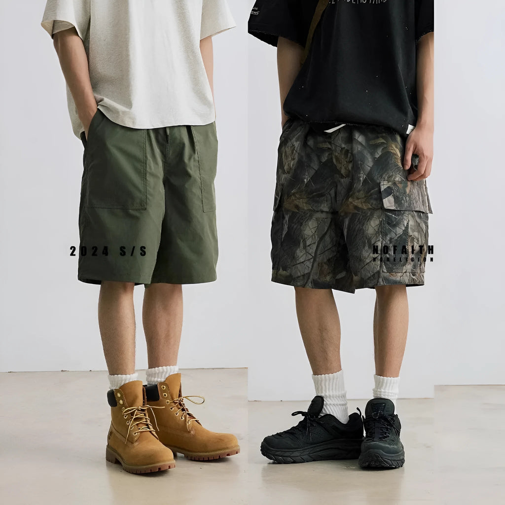 Loose casual straight-leg denim shorts in army green with a zip fly and elasticated waistband.