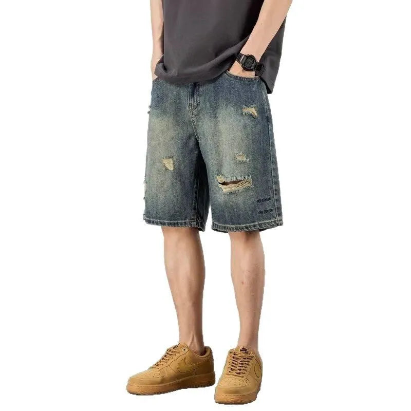 Blue men's denim shorts with a retro loose hole design and straight-leg cut.