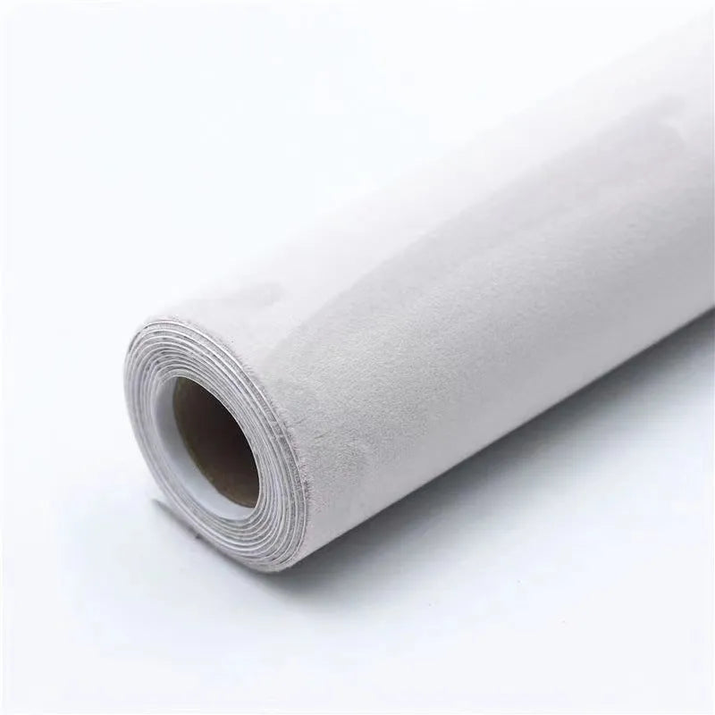 Self-adhesive leather suede sheet roll in multiple colour swatches showing black, brown, blue, and red.