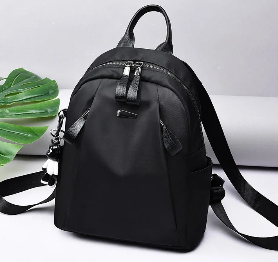 Medium Oxford cloth rucksack in black with internal phone and ID compartments