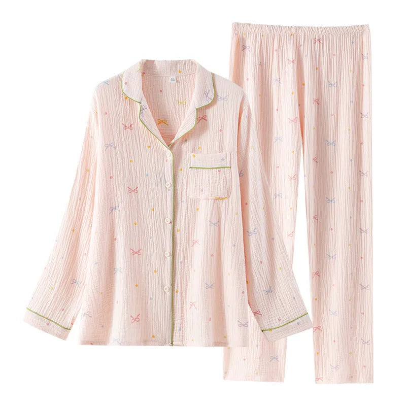 Women's beige long sleeve cotton pajama set with trousers, laid flat.