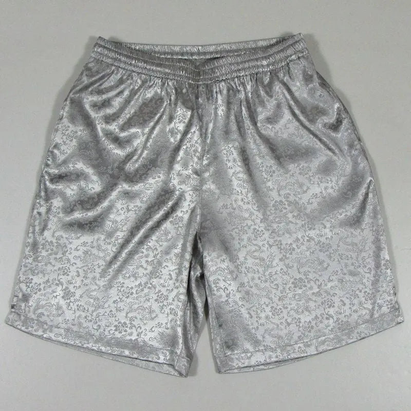 Men's black Tang Suit Tai Chi shorts with a white drawstring elastic waistband laid flat.