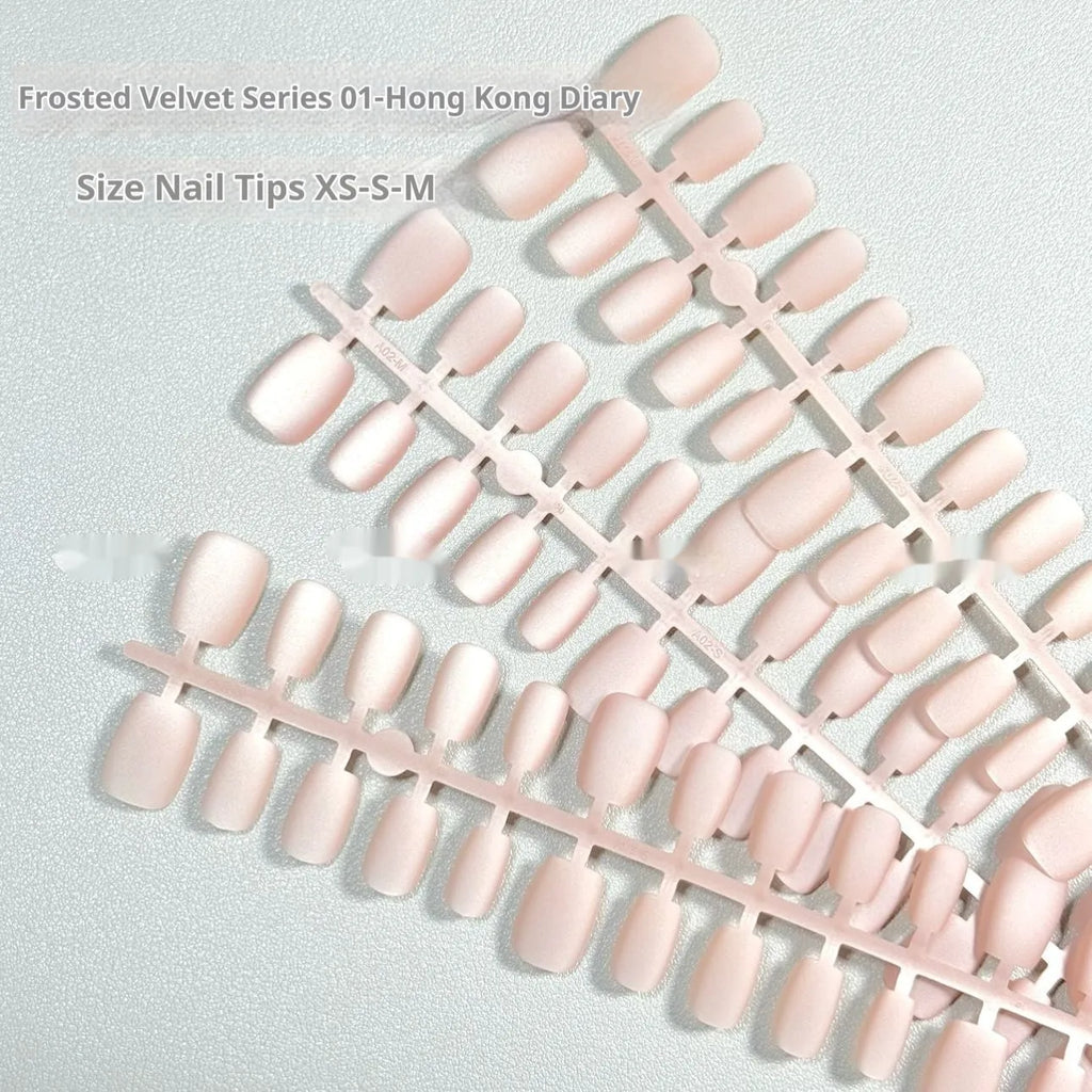 Set of frosted velvet false nails with Cat's Eye effect in short ladder sizes XS, S, and M on a clear background.