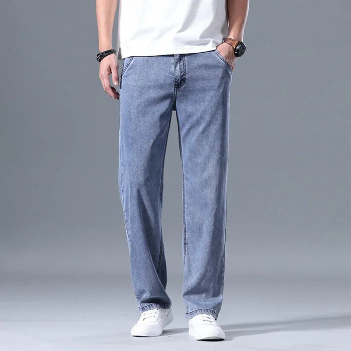 Men's straight leg loose fit lyocell jeans in blue and grey shades with zipper fly