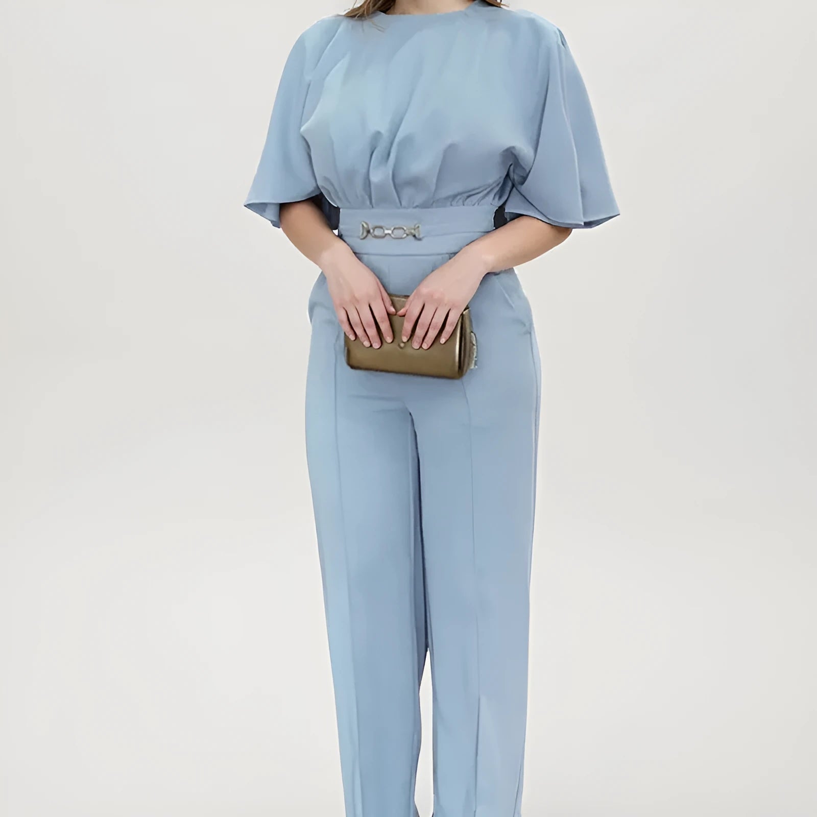 Blue polyester men's suit with long sleeve jacket and trousers on a hanger
