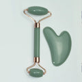 Stainless steel facial massage board with double head roller and heart-shaped eye poking stick for acupressure therapy