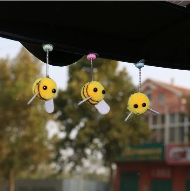 Swing spring bee car decoration with fur ball construction and cartoon design measuring 3x3cm