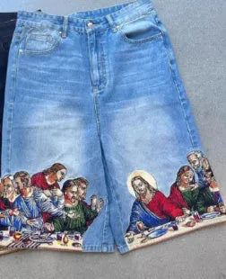 Blue men's cotton shorts with a Jesus design printed on the back pocket, showing tapered leg fit.