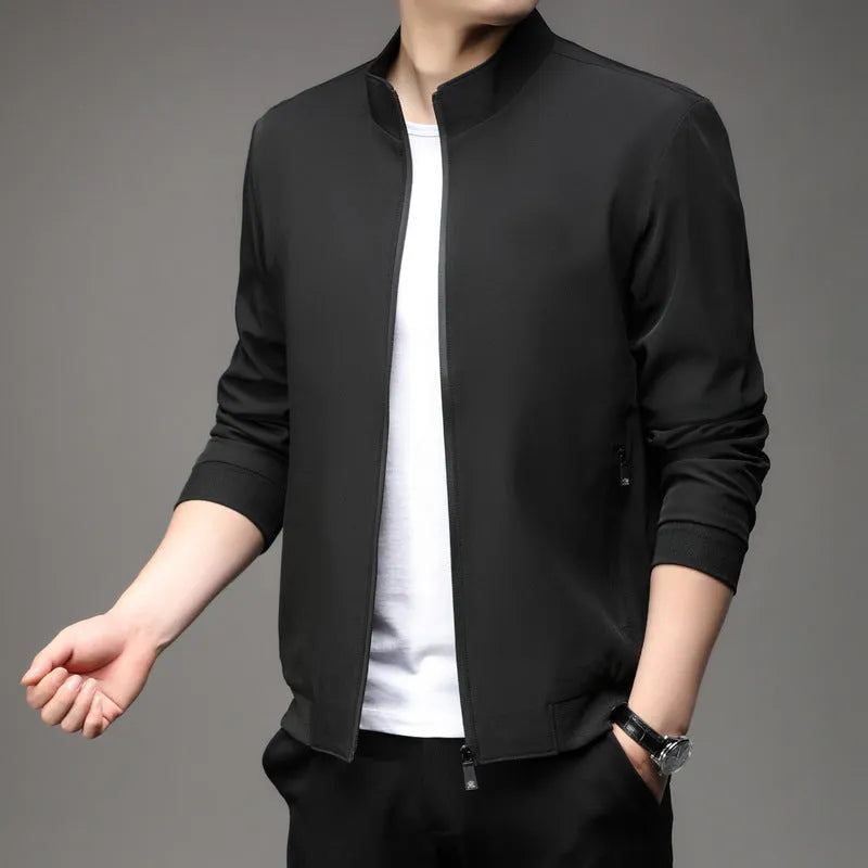 Korean style loose fit casual jacket in black with zip and patch pockets on a man.