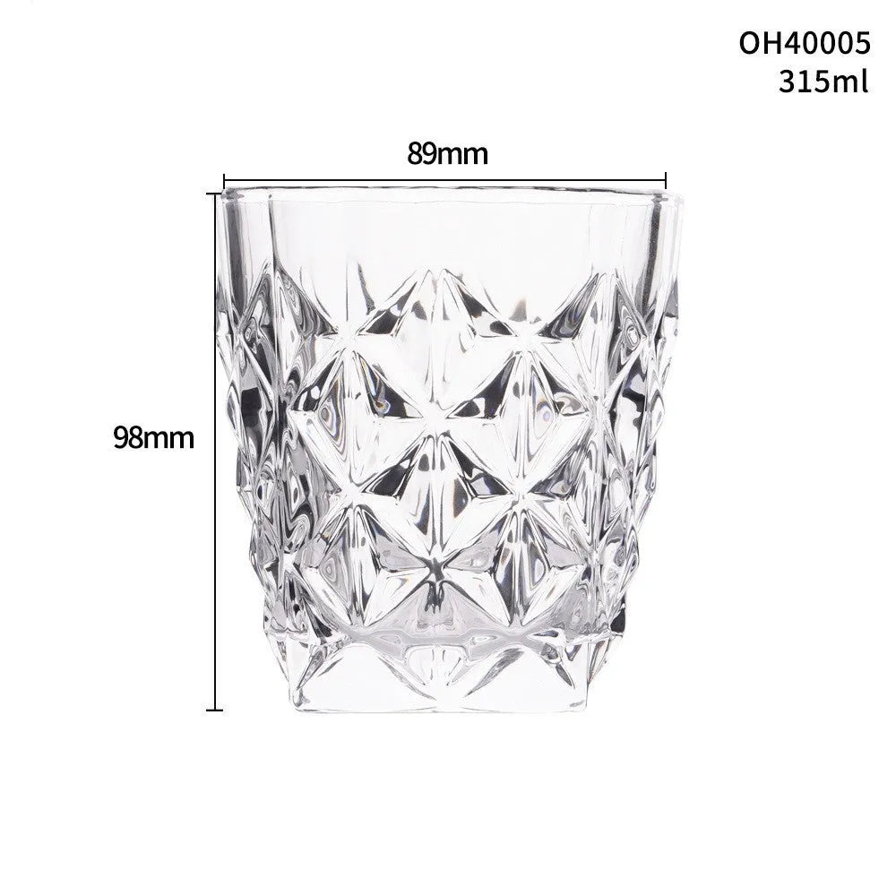 Clear thick-bottom whiskey shot glass with 301-400ml capacity on a table.