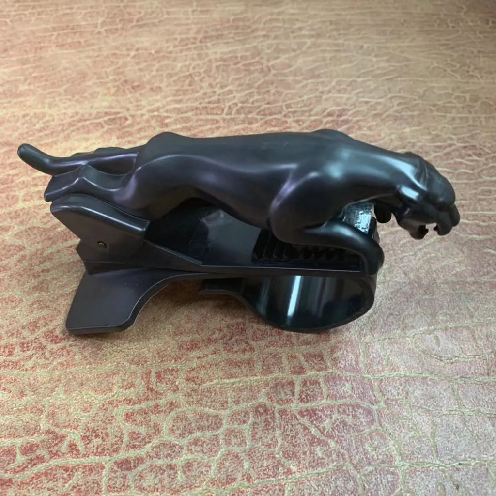 Car Leopard brand rotatable mobile phone holder in black on a car dashboard.