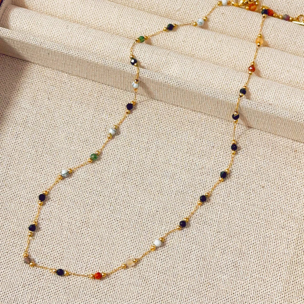 Gold titanium steel necklace with natural stone pendant showing O-ring chain and retro simple design