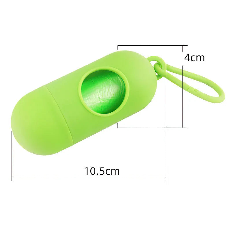 Compact black dog waste bag holder with side hook and velcro base for attaching to trousers or dog collars