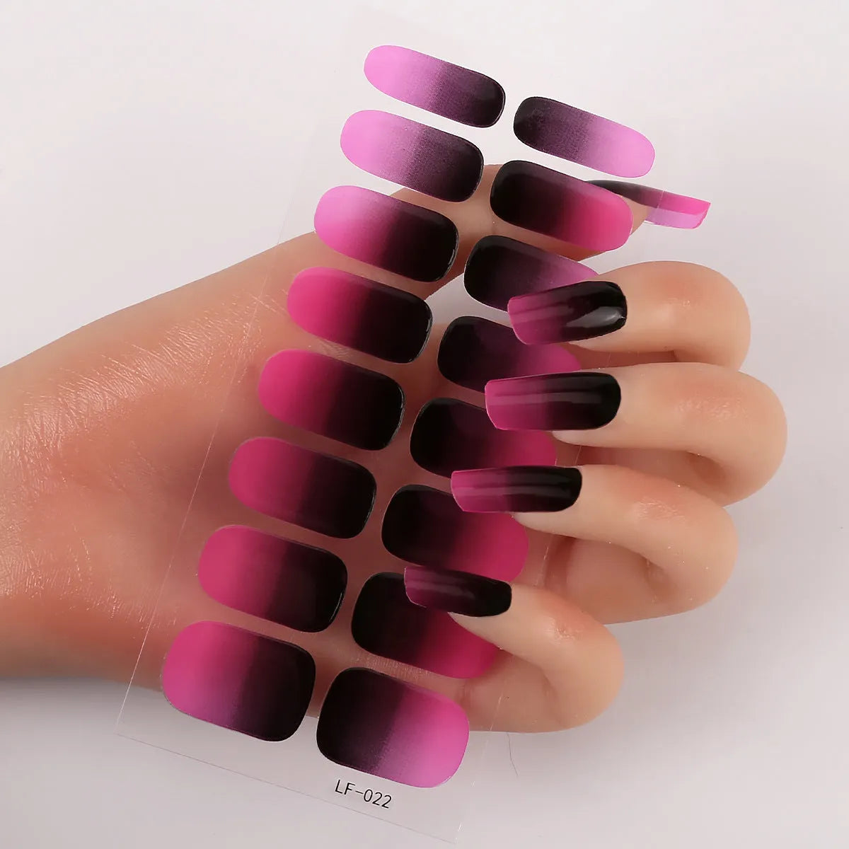 Full nail art sticker sheet showing 16 different solid colour designs including European simple nails and floral patterns