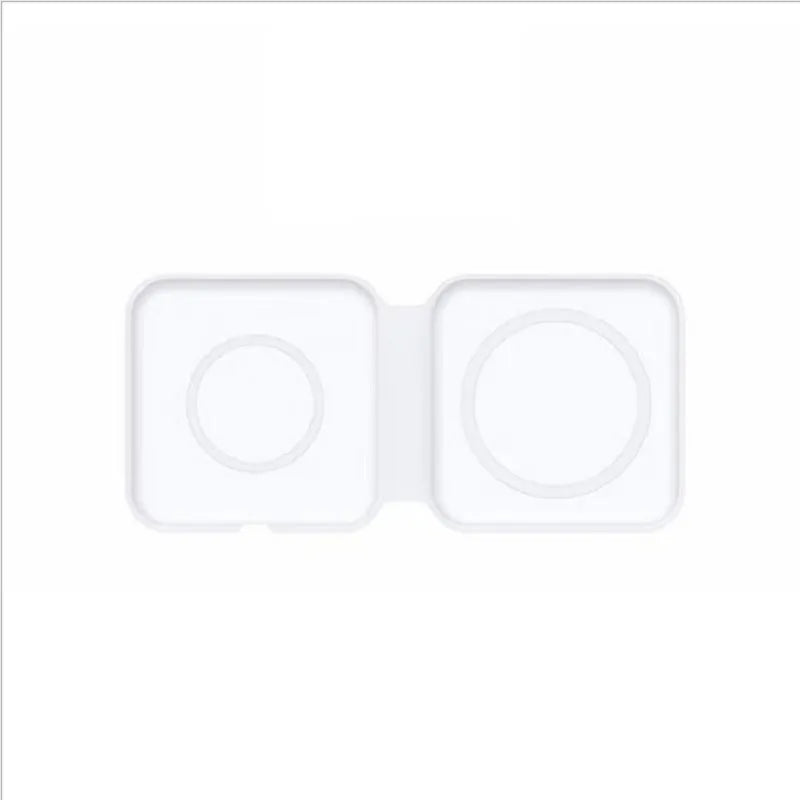 White foldable magnetic wireless charger charging two phones simultaneously on angled stand