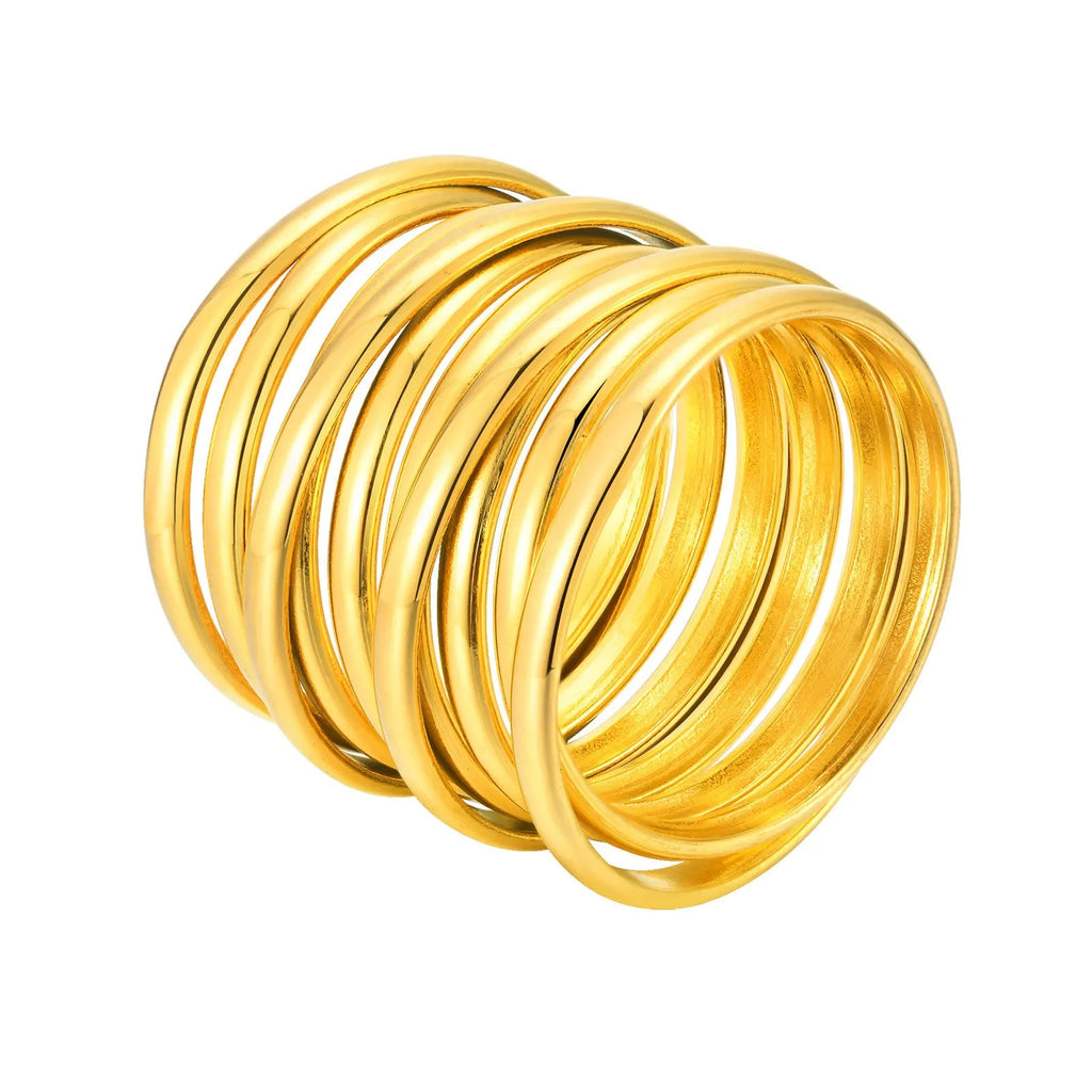 Gold stainless steel multi-loop multi-layer ring on a plain background