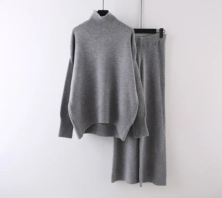 Women's beige acrylic sweater and wide-leg pants two-piece set laid flat.