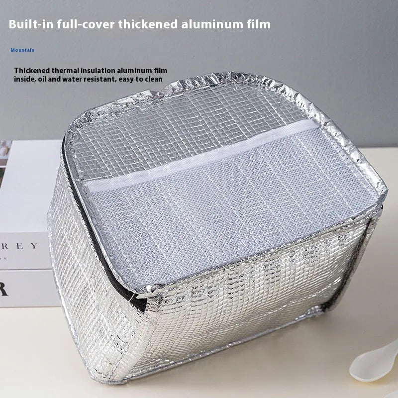 Textured cloth insulated lunch bag in sapphire blue colour with large capacity for a bento box.