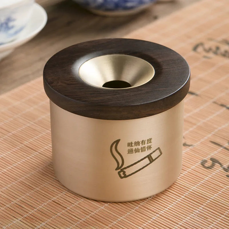 Brass retro ashtray with wooden lid in copper finish on living room table