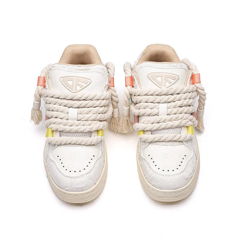 Old Damage creamy white retro low-top skate shoes with lace-up front and platform sole.