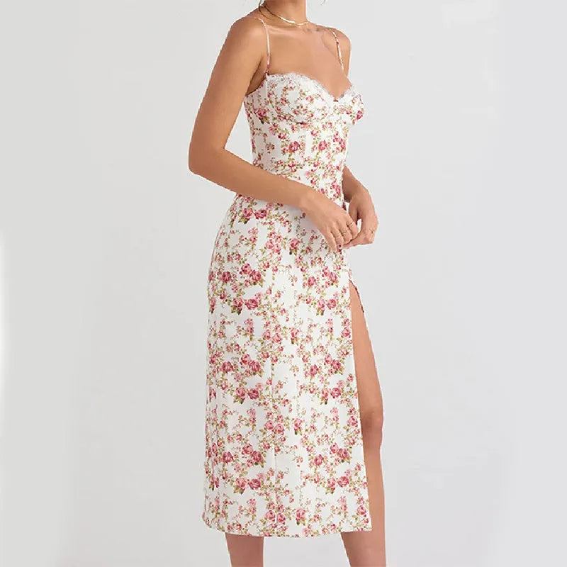 Women's long summer dress with lace flower print, suspender straps, and a high-leg slit.