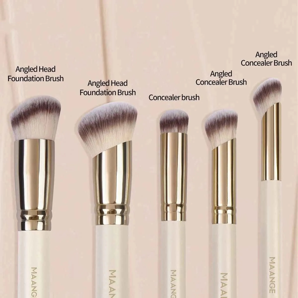 Apricot coloured angled makeup blush brush and four other synthetic brushes from a 5-piece set.
