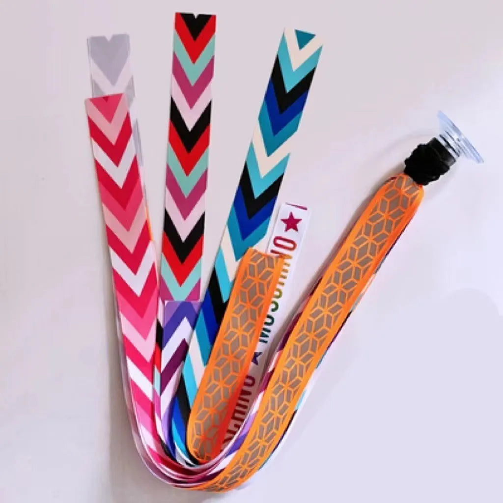 Close-up of a colourful decorative ribbon streamer attached to a child's helmet for roller skating or skiing.