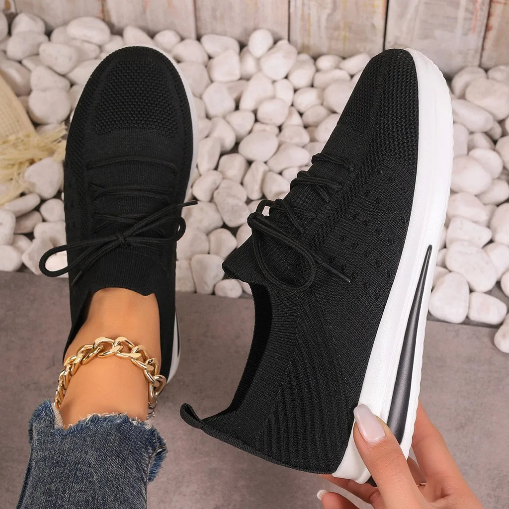 Women's low-top fly-knit sneakers in red colour with front lace-up closure and round-toe design