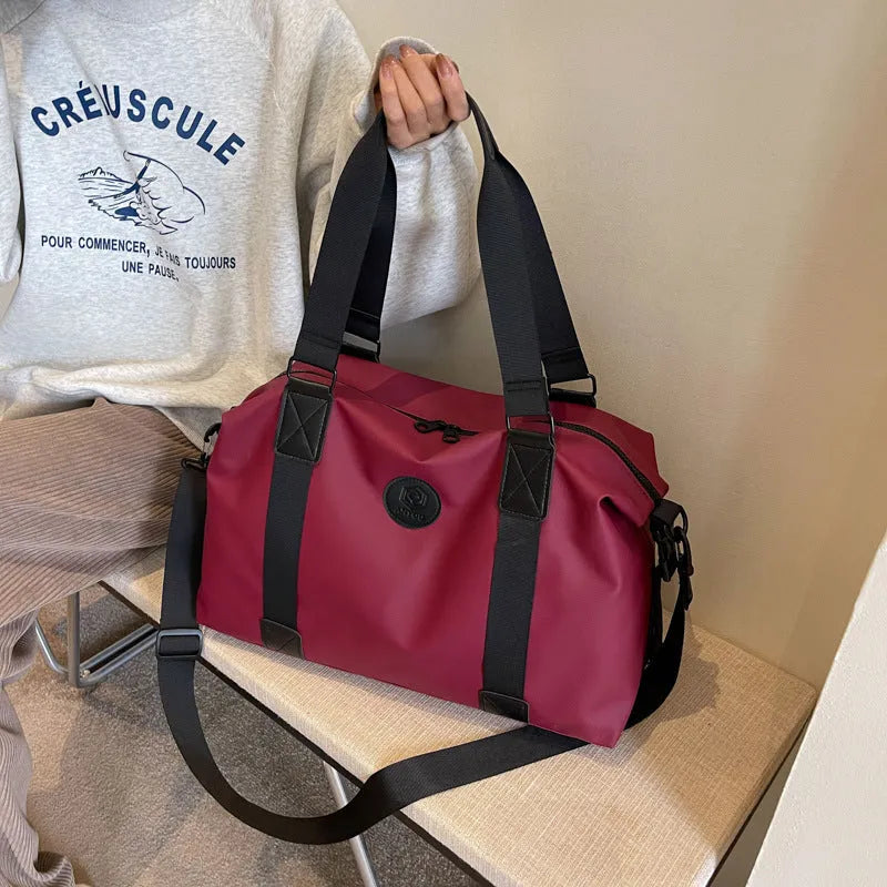 Waterproof Oxford cloth travel bag in solid colour with 36-55 litre capacity for short-distance trips
