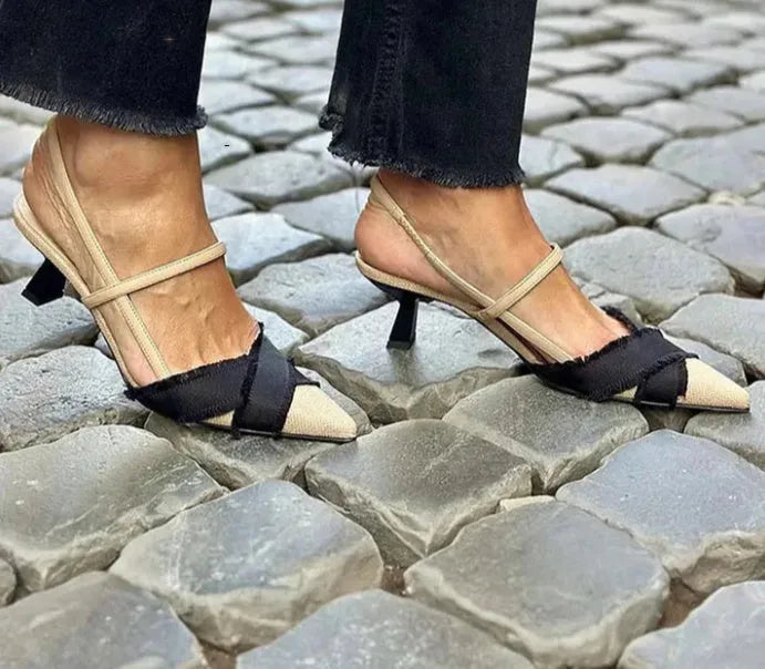 Women's apricot and black colour block stiletto sandals with a buckle fastening and pointed toe.