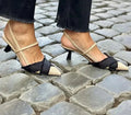 Women's apricot and black colour block stiletto sandals with a buckle fastening and pointed toe.