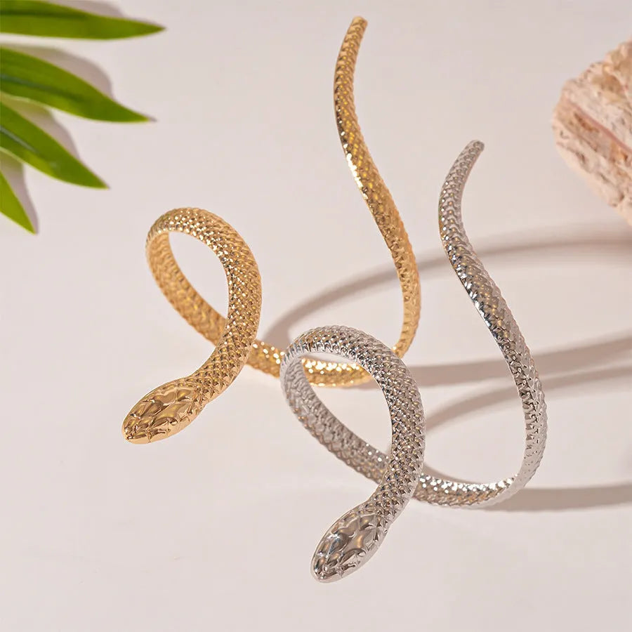 Gold and silver exaggerated twisted snake design ring and bracelet jewellery set