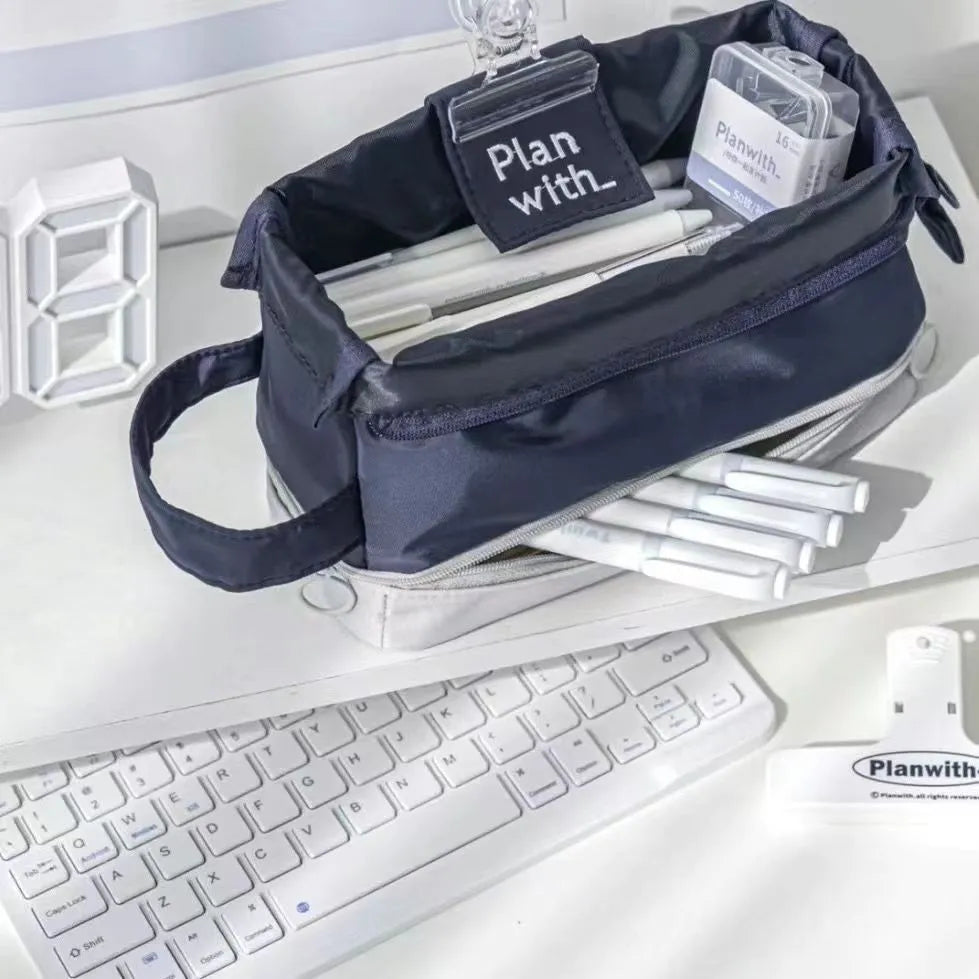 Dark blue folding double layer student pencil case made from polyester with internal compartments.