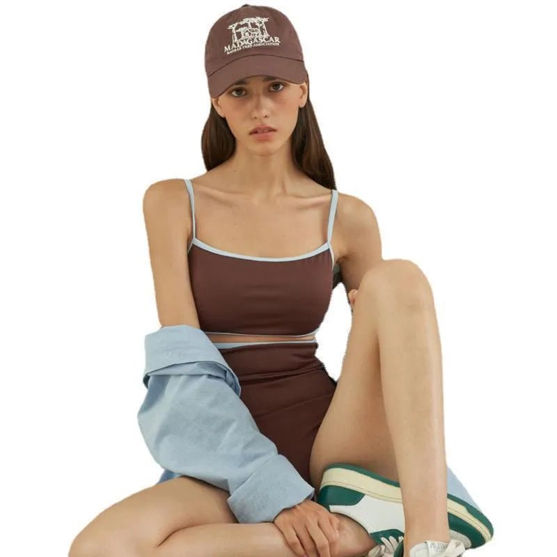 Brown triangle one-piece swimsuit for women on a hanger, showing front design.