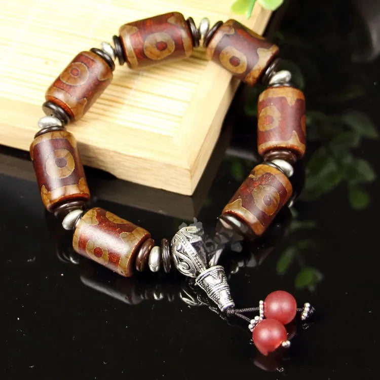 Agate Tibetan dzi bead bracelet with three-eye design and polished finish