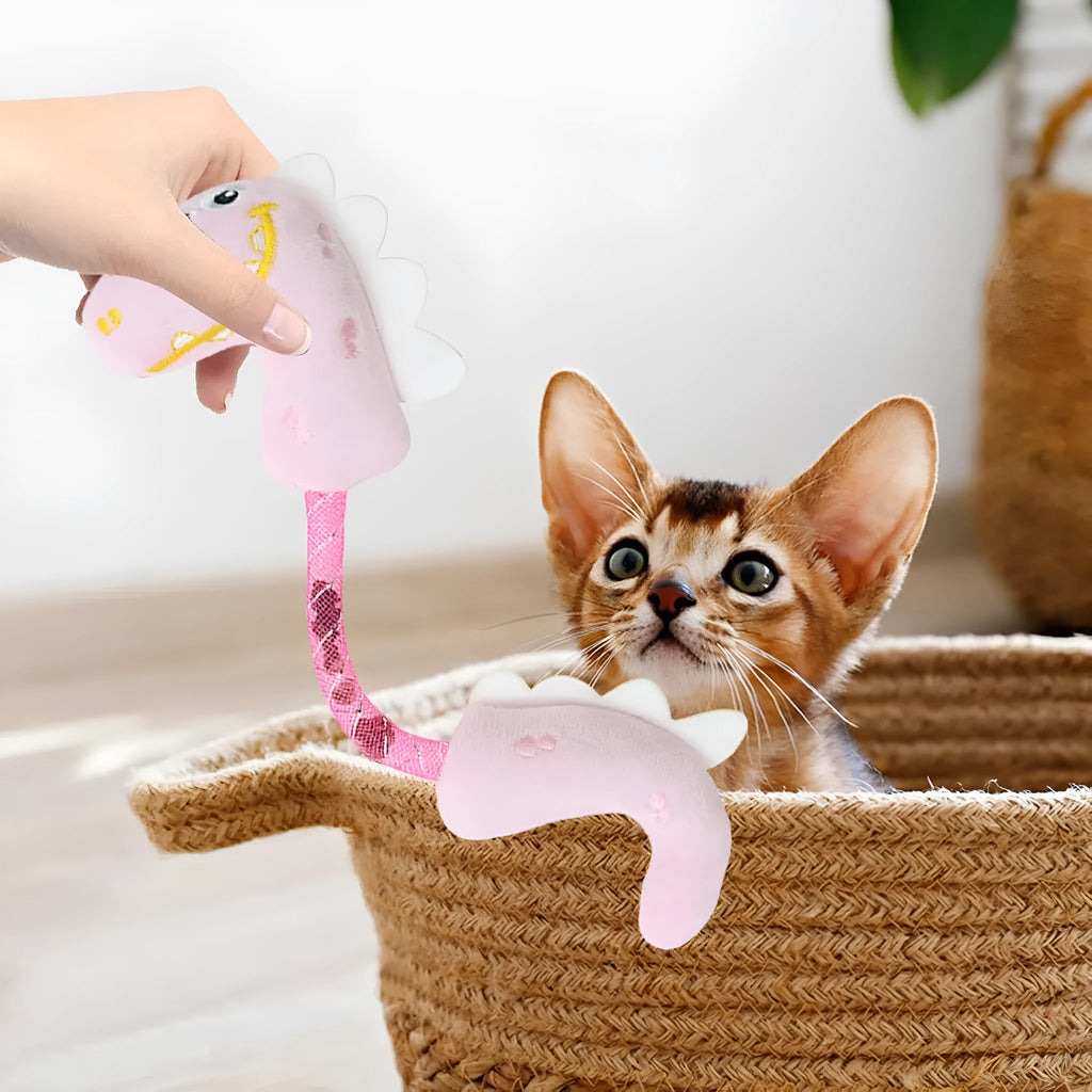 Four cat toys including rope, springs, and plush kicker toys in assorted colours