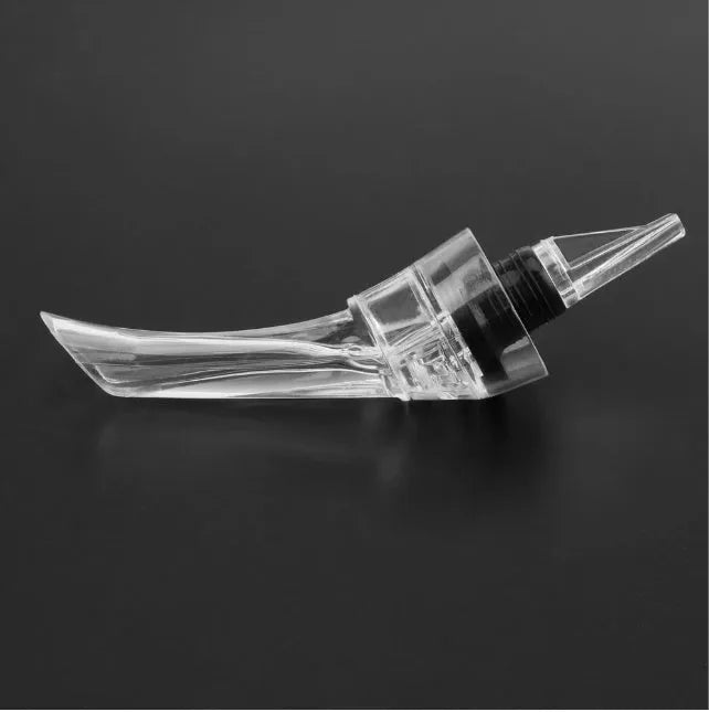 Compact transparent wine aerator with stainless steel filter measuring 16 by 4.2 centimetres