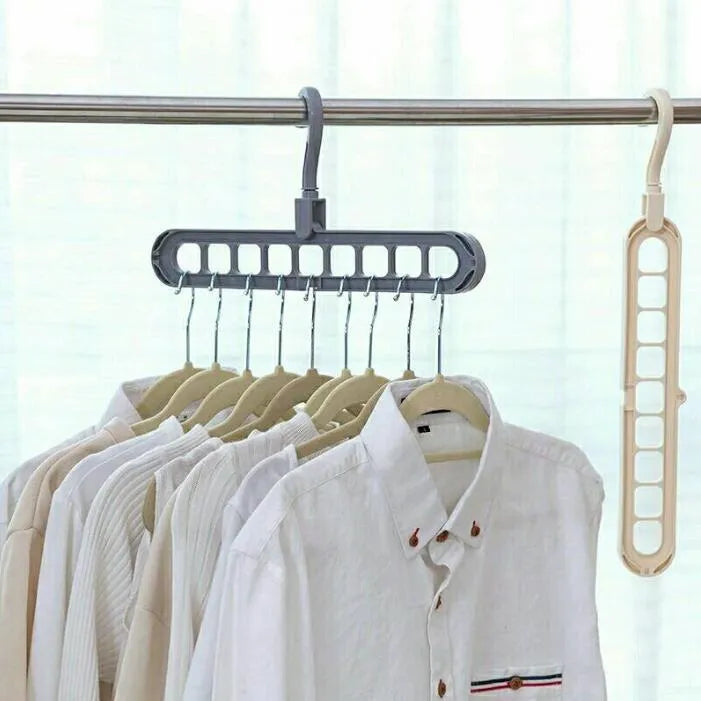 Plastic clothes hanger with rotating hook in assorted colours on white background