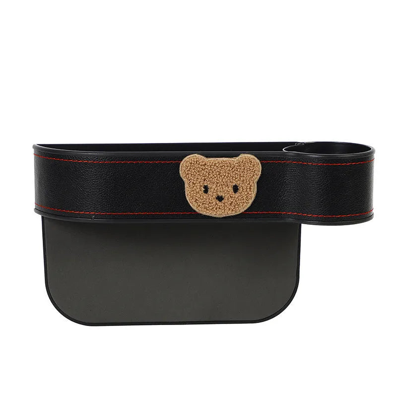 Leather car seat gap storage box with cartoon bear design hanging between vehicle front seats