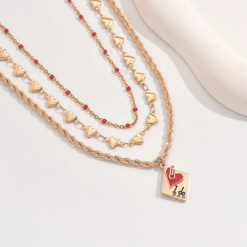 Gold-toned three-layer love heart necklace with geometric clavicle chain, adjustable 41-50cm