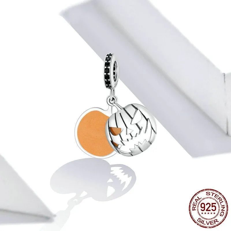 S925 sterling silver Halloween beaded bracelet with pumpkin and skull charms on a neutral background