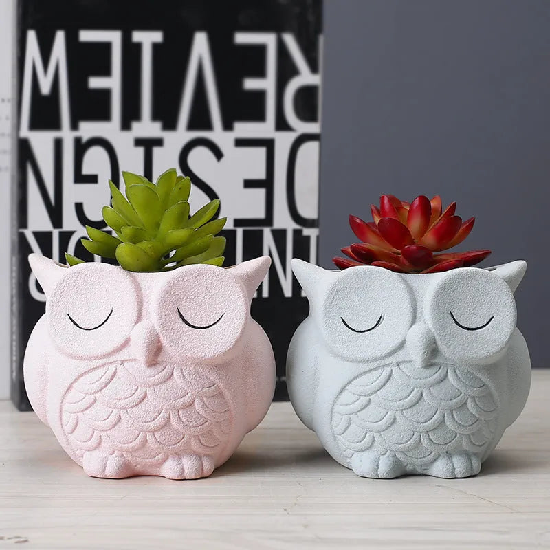 Handmade frosted ceramic flower pot with cartoon owl design, shown in light pink colour.