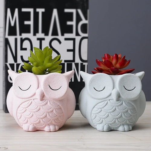 Handmade frosted ceramic flower pot with cartoon owl design, shown in light pink colour.
