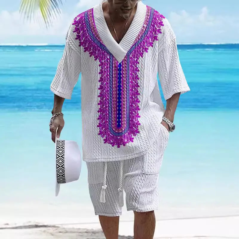 Man wearing a printed knitted drop-shoulder short-sleeved top with matching shorts from a co-ord suit set.